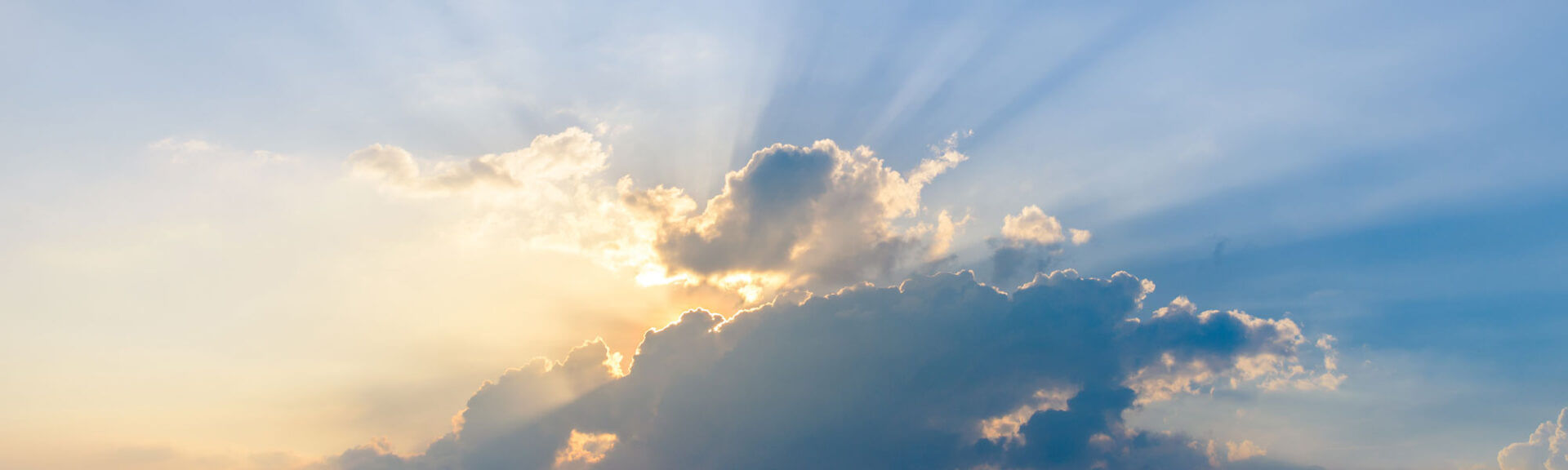 Beautiful Dramatic Sky Clouds With Light Rays At Sunset. Natural