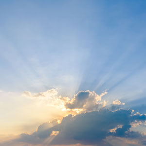 Beautiful Dramatic Sky Clouds With Light Rays At Sunset. Natural